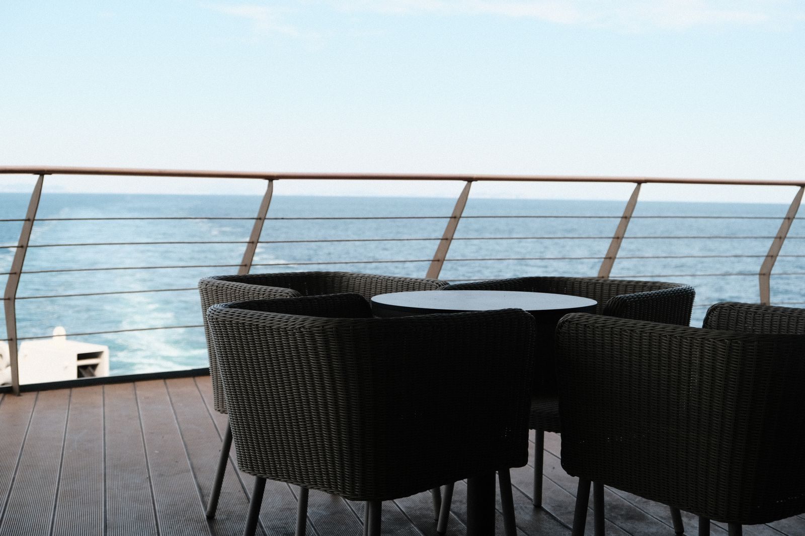 Cruise ship deck lounge with ocean view, where cruise rewards program members enjoy perks